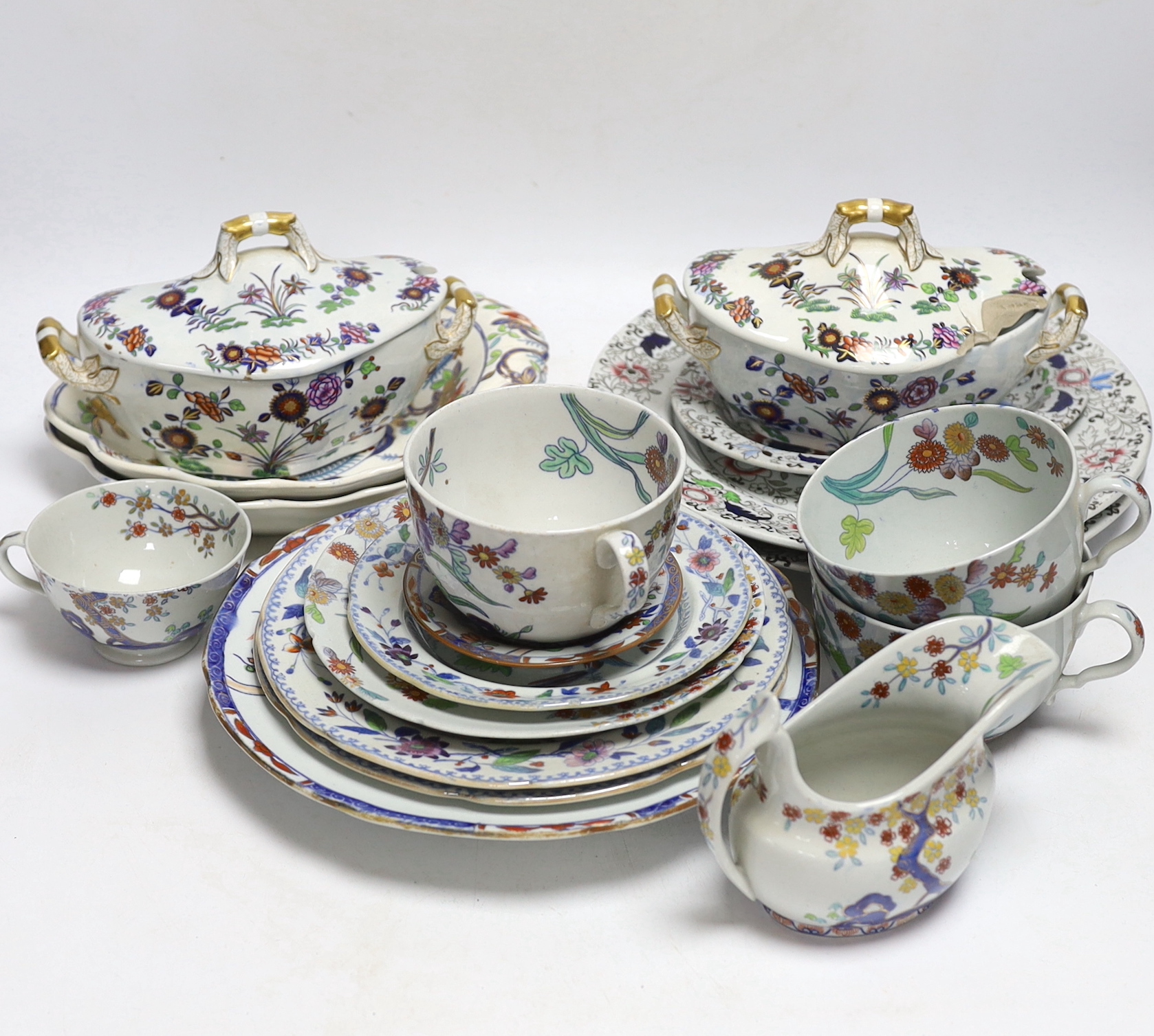 A collection of Spode Ironstone and pottery blue tea and dinnerware, including a pair of oval boat shaped sauce tureens and covers and a pair of shell shaped dessert dishes